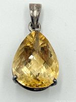 Front view of pendant showing citrine and silver setting