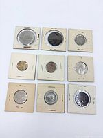 All nine coins in flips laid in three-by-three grid