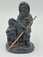 Front view showing both figures and spear