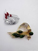 Front view of both brooches showing design and stone colours