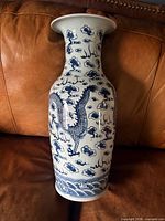 Vase front showing dragon, cloud motifs, wave border
