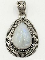Front view showing moonstone cabochon, silver border, bail