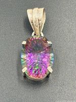 Front view showing oval mystic topaz and prong setting