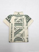 Front view of origami shirt made from one-dollar bill