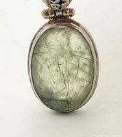 Front view showing oval rutilated quartz and bezel