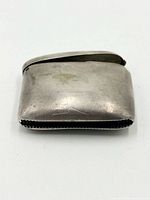 Front view of silver metal lighter holder case
