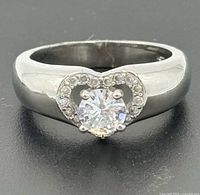 Front view of ring showing heart bezel, central stone and halo