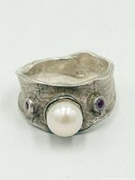 Front view showing pearl and rubies on hammered band