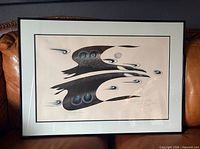 Full view of framed artwork on sofa