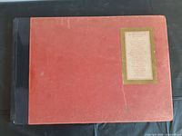 Front cover of large red and black hardcover book