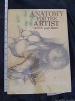 Front cover showing title, author, and size reference tape