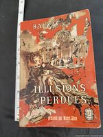 Front cover of the paperback showing title, author, presenter, and Le Livre de Poche logo with measuring tape for scale