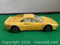 Left side profile of yellow Durango Ferrari GTO model car