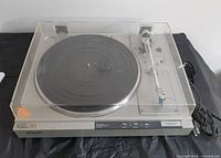 Overall view of Sony PS-LX33 turntable with dust cover closed