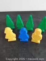 Front view showing three trees and three figures