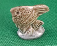 Front view of Wade angel fish figurine on green background
