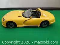 Driver side profile of yellow Dodge Viper RT/10 model