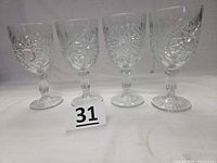 All four Libbey Hobstar goblets side by side