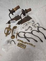 All items laid out including sconces, hooks, door knocker, pull handle, chain guard