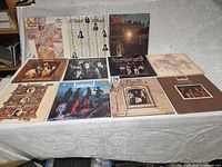 All eleven album covers laid out