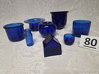 Group shot of all seven cobalt glass pieces