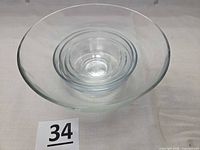 Five clear glass bowls nested together
