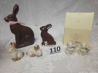 Group shot of all six bunny figurines with Lenox box