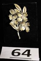 Front view of Coro dogwood brooch with enamel flowers and AB rhinestones