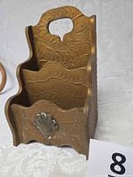 Front angled view showing overall form and shell applique