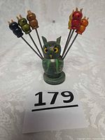 Holder front with six coloured picks displayed