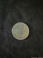 Reverse showing Canadian coat of arms with 50 CENTS and date