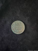 Reverse view with Canadian Coat of Arms and 1952 date