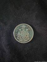 Reverse side with Canadian Coat of Arms and 1963 date visible