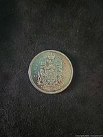 Reverse side showing Canadian coat of arms, CANADA 1965 50 CENTS legend