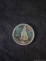 Reverse of 1967 Canadian 50-cent coin showing howling wolf