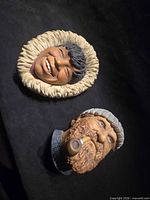 Both Bossons wall masks side by side