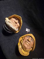 Both Bossons head plaques side by side