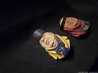 Both Bossons heads side by side on black background