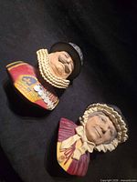 Both Bossons plaques lying flat, showing overall size and paint detail