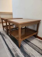 both matching wooden side tables front side angle