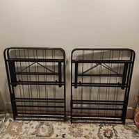 both folded bed frame halves standing upright