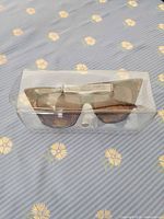 Sunglasses inside clear plastic case