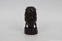 Front view of carved wooden bust