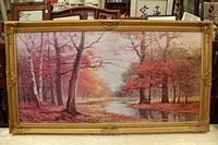 front view of framed autumn landscape print showing image and ornate gold frame