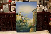 Front view of full canvas painting showing village, water and sky