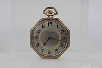 Front view showing dial, case shape, and condition