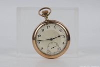 Front view showing dial, hands, bow crown, and case bezel