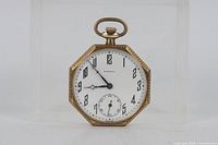 Front view showing dial, numerals, hands, and subsidiary seconds