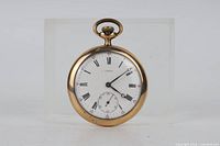 Front view showing white dial with Roman numerals, subsidiary seconds, gold-filled bezel and bow