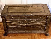 front view showing embossed motif and lion’s paw feet